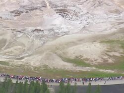 WS AERIAL View of tourist seeing Old faithful cone geyser / Wyoming, United States Stock Footage