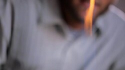 Teacher supervises a student using Bunsen burner Stock Footage