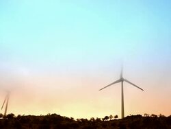 Wind turbines in fog Stock Footage