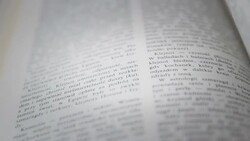 Flipping pages in a book Stock Footage