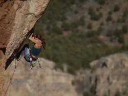WS TU TS Climber makes few difficult moves on steep rock face then falls off and rope catches her / Canon City / Shelf Road,CO,USA Stock Footage