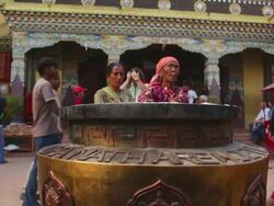 WS Shot of people passing by incense pot at Boudhanath Stupa / Kathmandu, Nepal Stock Footage