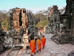 MS Three Monks in Saffron robes walking  inside of temple  / Cambodia Stock Footage