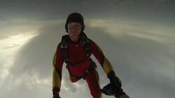 POV skydiving holding hands under a cloudy sky doing tricks with a smiling woman Stock Footage