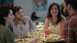 Friends talk and laugh together in restaurant Stock Footage