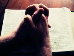 Hands Folding On Bible Stock Footage