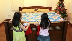 Portrait of happy girl decorating Christmas tree Stock Footage