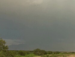 Lightning strikes the ground while a photographer takes a picture, photographer celebrates getting the shot, Desert thunderstorm, Arizona monsoon Stock Footage