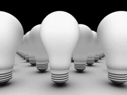 CGI DOLLY left across infinite old bulbs as they dissolve and turn into new bulbs Stock Footage