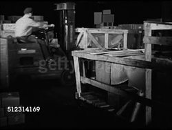 1947: CLEVELAND EXPORT/IMPORT: OHIO: VS Workers moving boxes in warehouse, moving crates w/ cart, loading boxcar w/ boxes, sliding door shut. EXT HA WS EARLY MORNING Cargo trains passing each other. OH Instructional Video