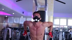 Male Athlete performing dips at the gym with extra weight Stock Footage
