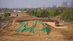 Truck working on a construction site, building a residential district Stock Footage