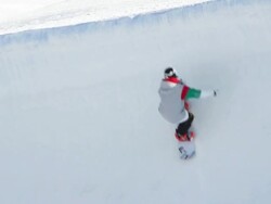 WS SLO MO TS View of Snowboarder jumping and turning two times with snowboard at ski slopes of Pyeongchang(The venue for the 2018 Winter Olympics ) / Pyeongchang, Gangwon do, South Korea  Stock Footage
