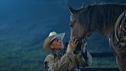 SLO MO Cowboy spending time with horse in the evening Stock Footage