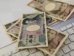 Falling on the keyboard of the Japanese Yen Stock Footage