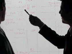 MS Two businessmen discussing in front of white board / China Stock Footage