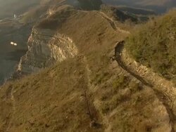Medium Long Shot aerial push,in , A narrow, winding road leads to a coal strip mine operation. / West Virginia Stock Footage