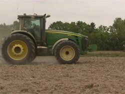 Tractor moves across the rice field. Stock Footage