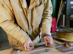 MS TU TD Metalsmith working in his studio / Santa Fe, New Mexico, United States    Stock Footage