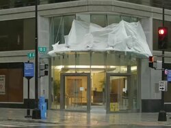Damaged building and emergency vehicle in storm Stock Footage