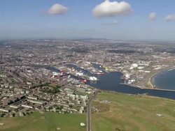 Aerial view approaching the city of Aberdeen and the harbor / Aberdeen, Scotland Stock Footage