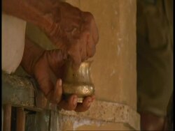 CU hand of Hindu priest annointing people in Hindu Temple, Bandhavgarh National Park, India Stock Footage