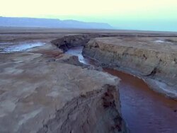  AERIAL WS TS  View of muddy surface of dead sea in desert / Sourn Judea Desert, Israel  Stock Footage