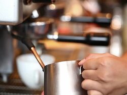 HD: Barista prepare milk foam using latte steamer Stock Footage
