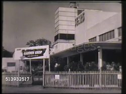 1951: SEARS: VS Various Sears stores, Sears service station, farm store, garden shop, & department stores, Sears building, delivery truck driving. Sears, Roebuck and Co. Instructional Video