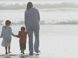 Mother & Children Ocean Waves Stock Footage