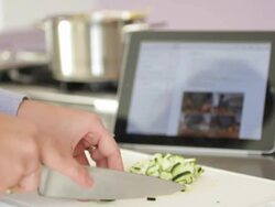 Close up of female in kitchen preparing food Stock Footage