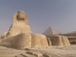 Wide Shot, pan-right tracking-right - The Sphinx stands majestically in the desert / Egypt Stock Footage