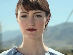 Young woman at a wind farm Stock Footage