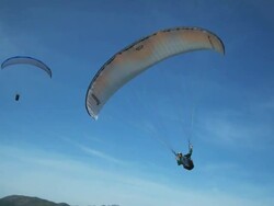 WS PAN POV Young man paragliding mid-air / Lehi, Utah, USA. Stock Footage