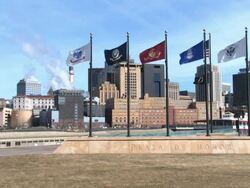 A view of the St. Paul skyline with flags of the armed forces in the foreground Stock Footage