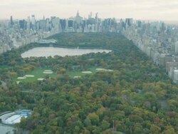 Aerial flying over Harlem then camera pans up to reveal Central Park Stock Footage