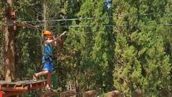 boy in the municipal rope park Stock Footage