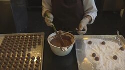 woman chef making chocolate candy in the cafe Stock Footage