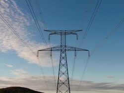 Time lapse zoom of electrical lines and pylon at sunset Stock Footage