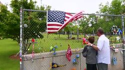 Oklahoma City Oklahoma OKC City downtown Memorial Wall dad showing son messages at bombing site on April 1995 Stock Footage