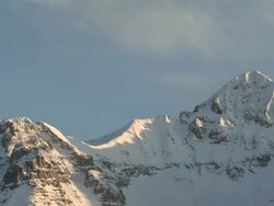 MS T/L View of Clouds and Snow Rolling over Majestic Mountain Peaks in evening Light / Telluride, Colorado, United States Stock Footage