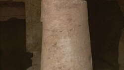 A cracked column supports the roof of crumbling ruins in the ancient town of Sikait, Egypt. Stock Footage