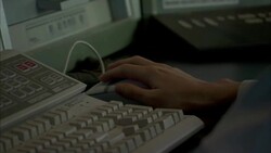 A specialist removes a hand from a computer mouse. Stock Footage