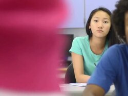Multi-Ethnic Students in Classroom - rear focus Stock Footage