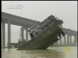Nine people are still reported missing after a portion of a bridge in southern China collapsed into a river.  Officials say a boat overloaded with sand struck one of the bridge's support pillars.  (June 16) Instructional Video