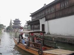 MS View of tour boats on river in village of Zhujiajiao / Shanghai,  China Stock Footage