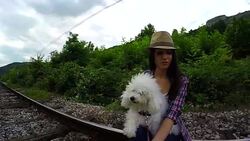 Woman and dog waiting for the train. Stock Footage
