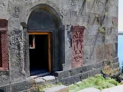 Hayravank monastery, Sevan lake, the faÃƒÂ§ade of the church and the Sevan lake in the background Stock Footage