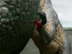 Medium Close Up static - A dinosaur digs its talons into the skin of another dinosaur in a computer-generated animation. / Washington, DC, USA Stock Footage