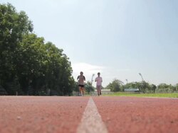 Couple running in sport track Stock Footage